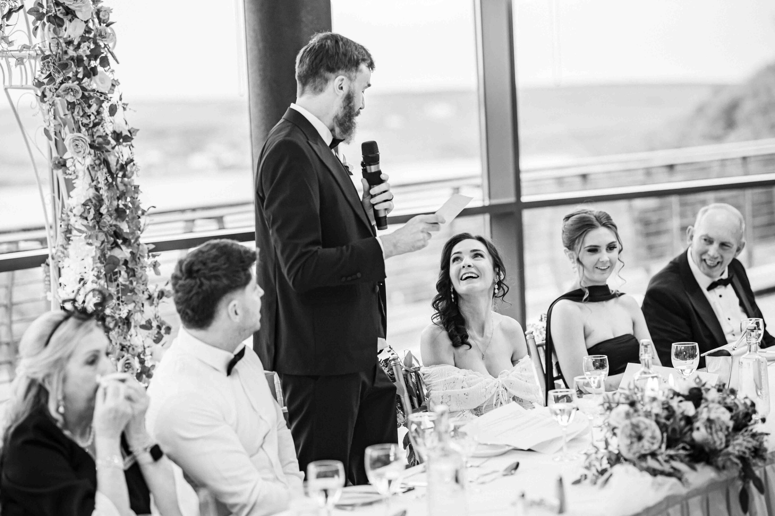 Groom raising glass during speeches — Cork wedding photographer Kinsale — JOD Photography