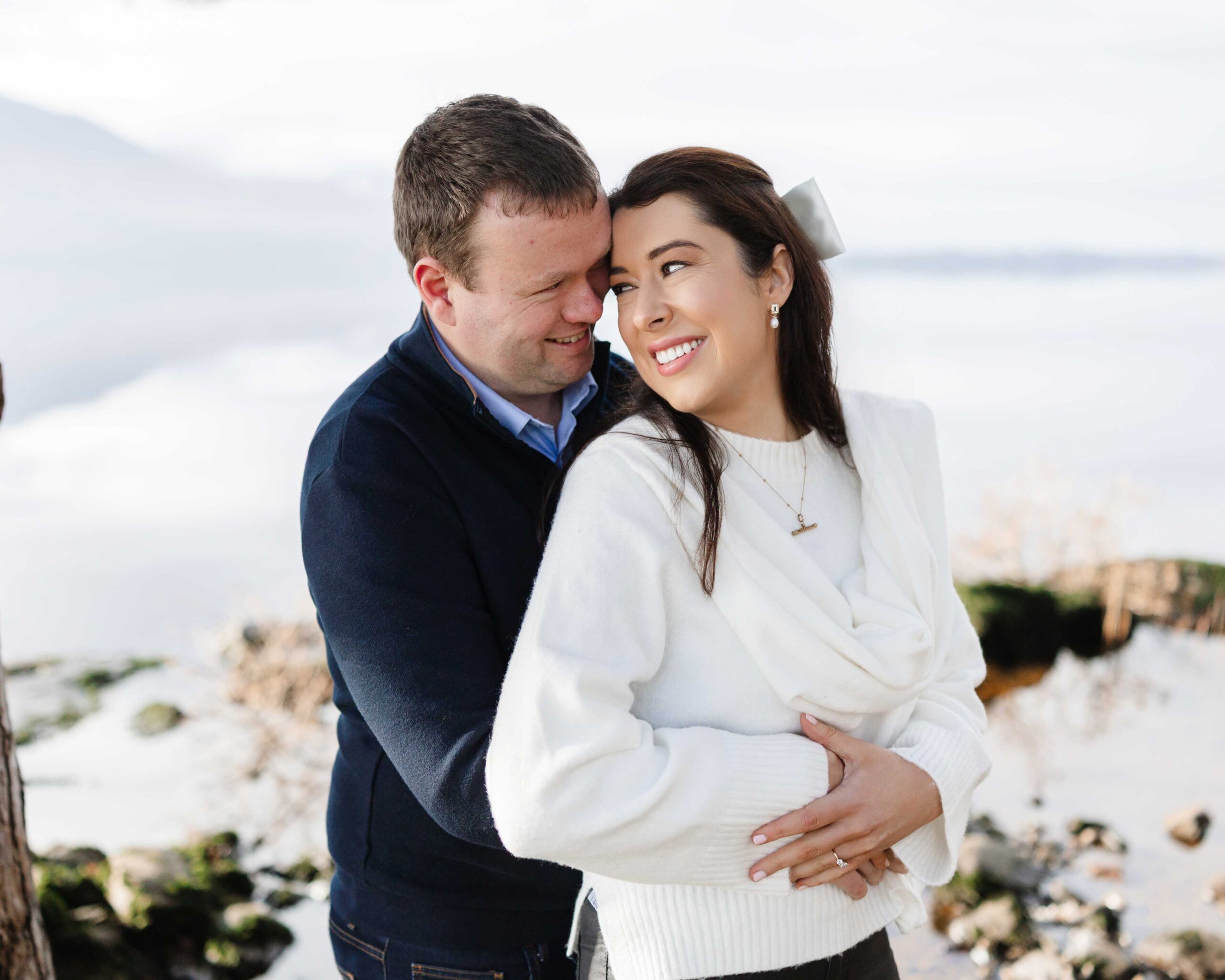 Couple walking together during relaxed engagement shoot at Killarney Golf Course with Kerry mountains behind — JOD Photography