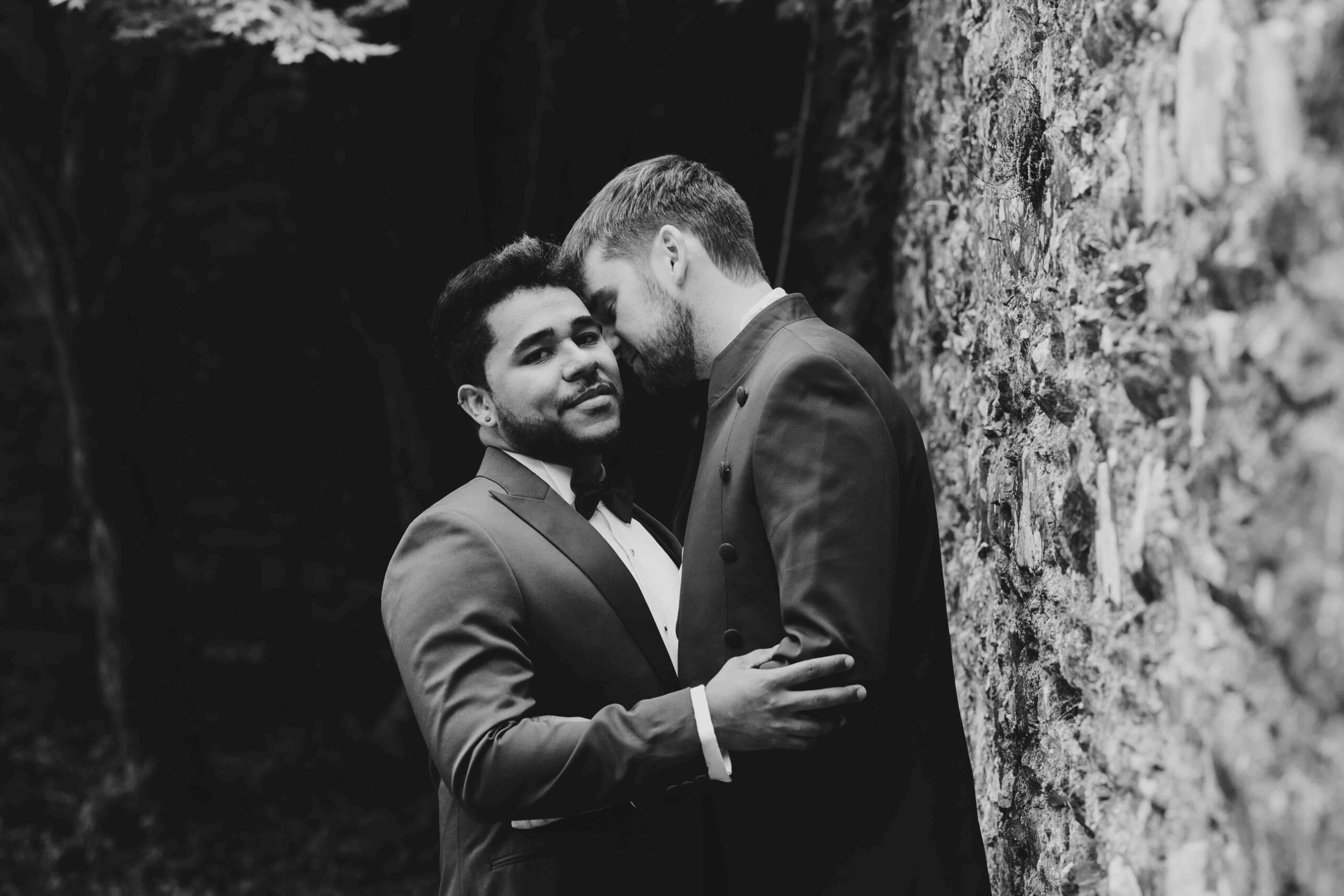 Wedding guests sharing laughter during reception — JOD Photography