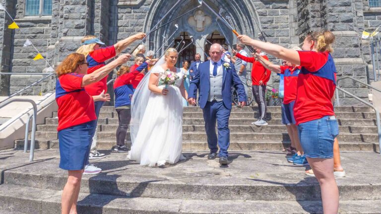 Bride sharing laughter with bridal party — JOD Photography