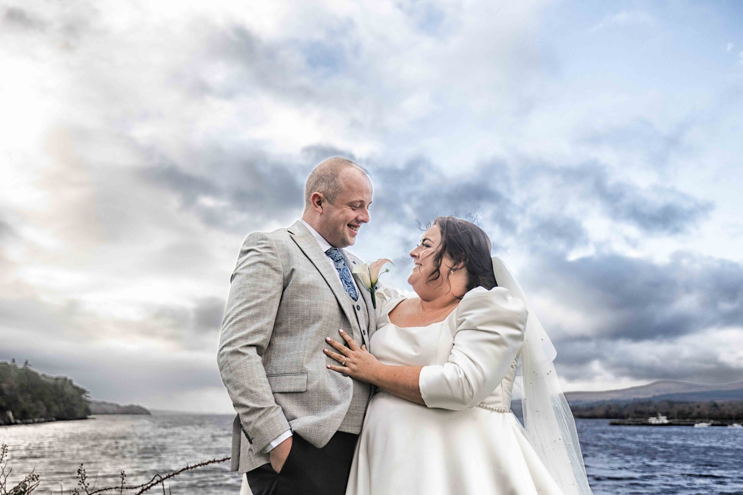 Shane and Katie smiling through the rain outside Kenmare Bay Hotel — JOD Photography