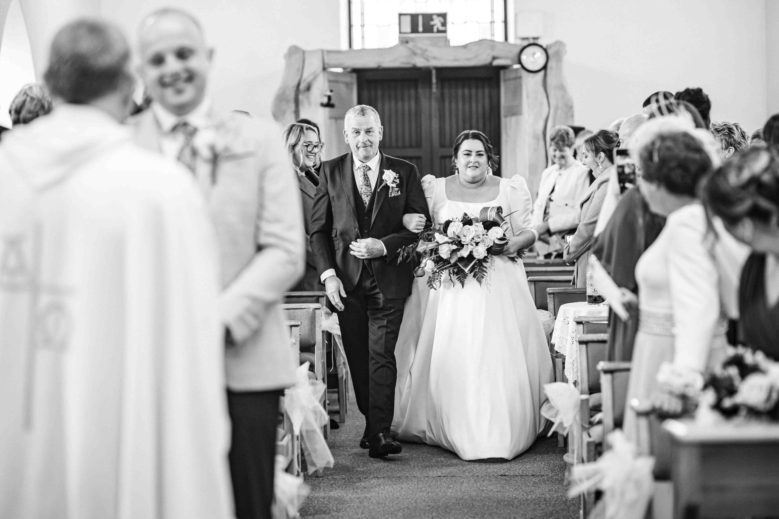 Bridal party bracing the wind during portraits in Kenmare — JOD Photography