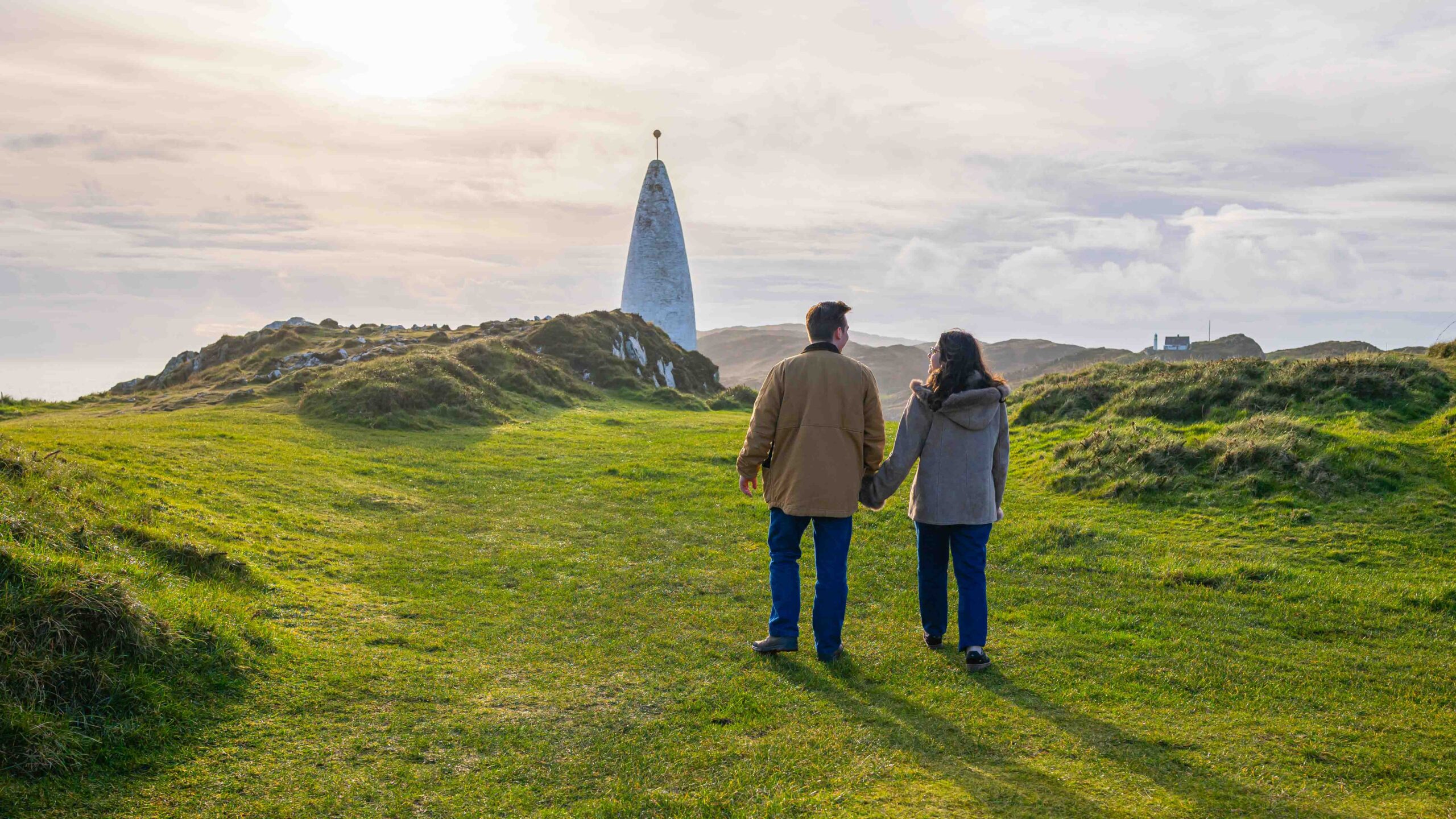 Engaged couple embracing after proposal at Baltimore Beacon, West Cork