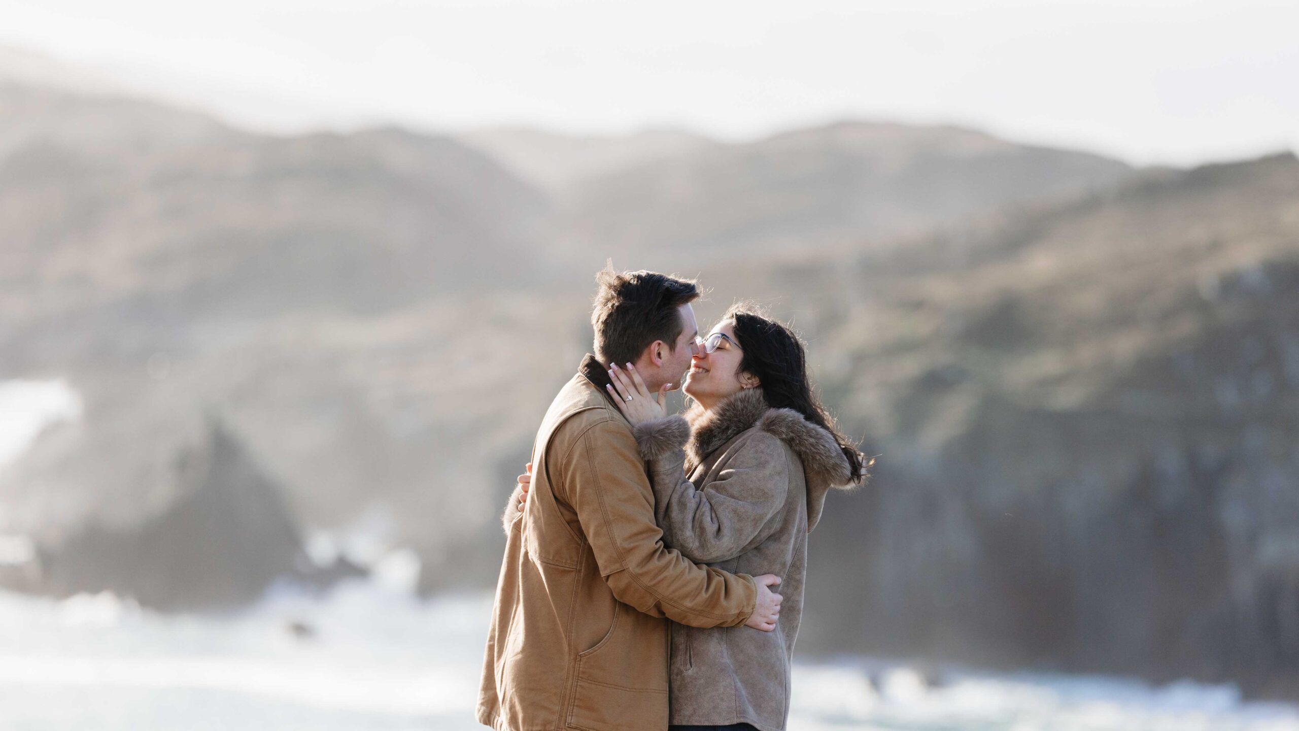 Romantic engagement photography at Baltimore Beacon with rugged Irish landscape