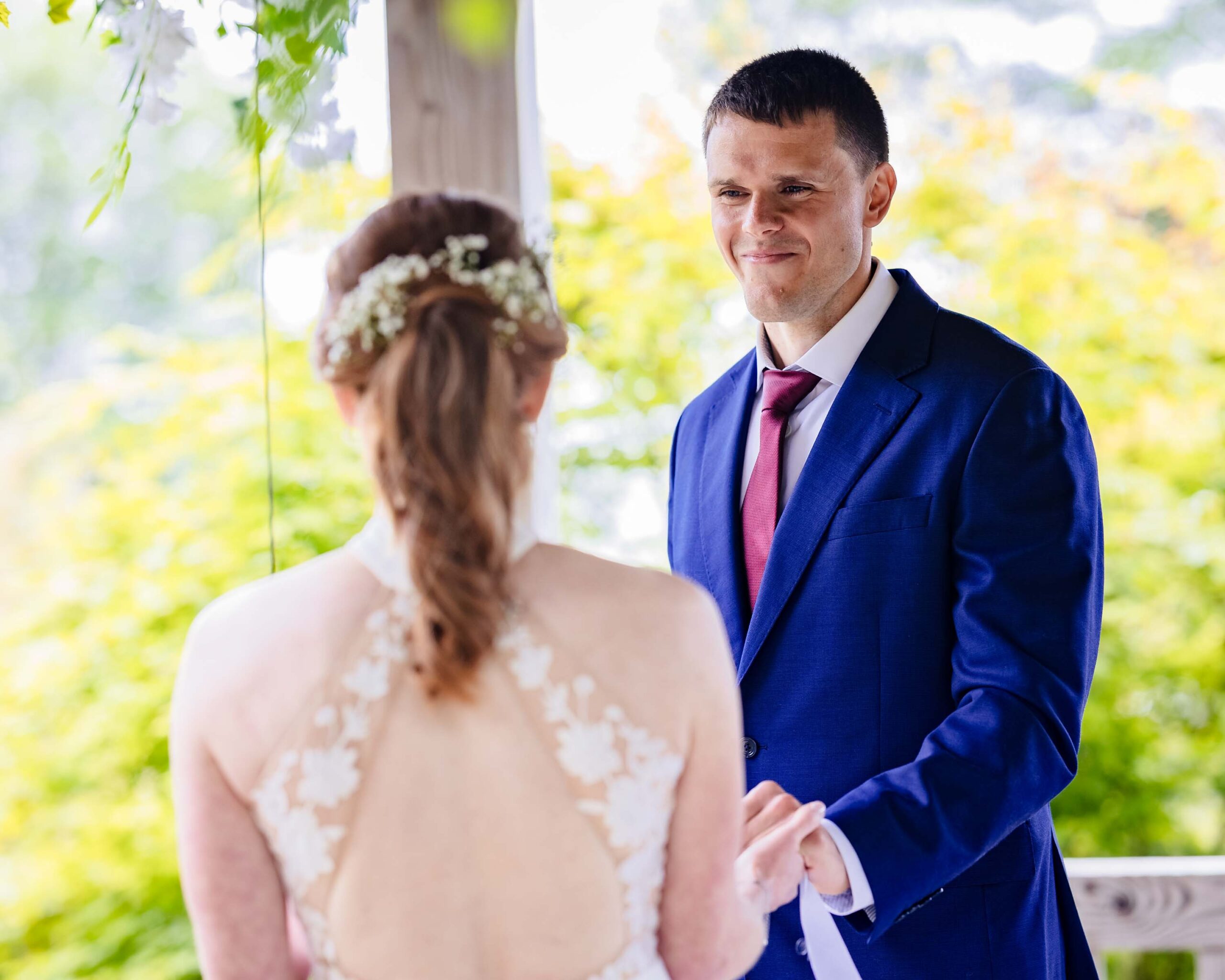 Groom smiling during intimate Irish wedding ceremony