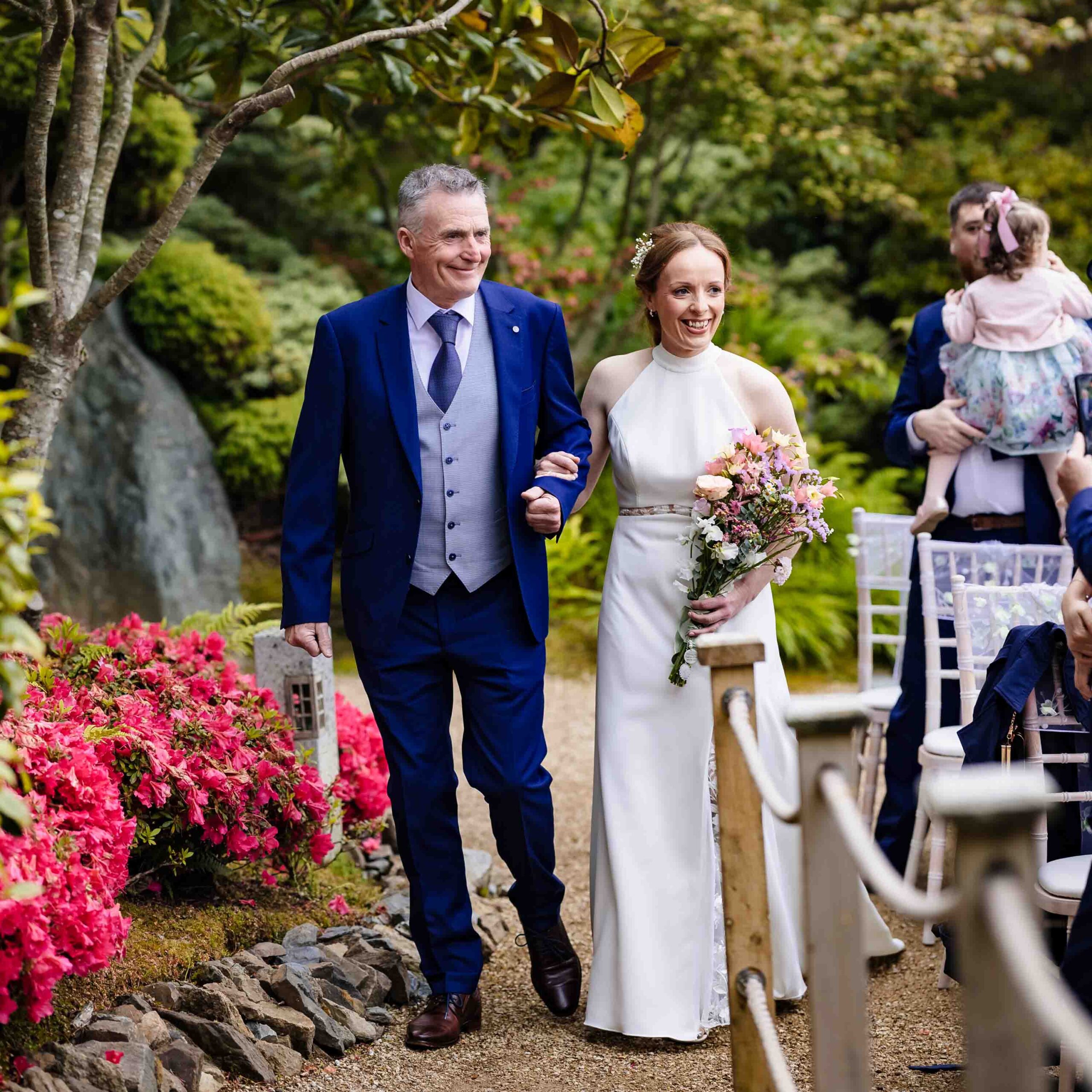 Bride and father walking through Japanese Gardens