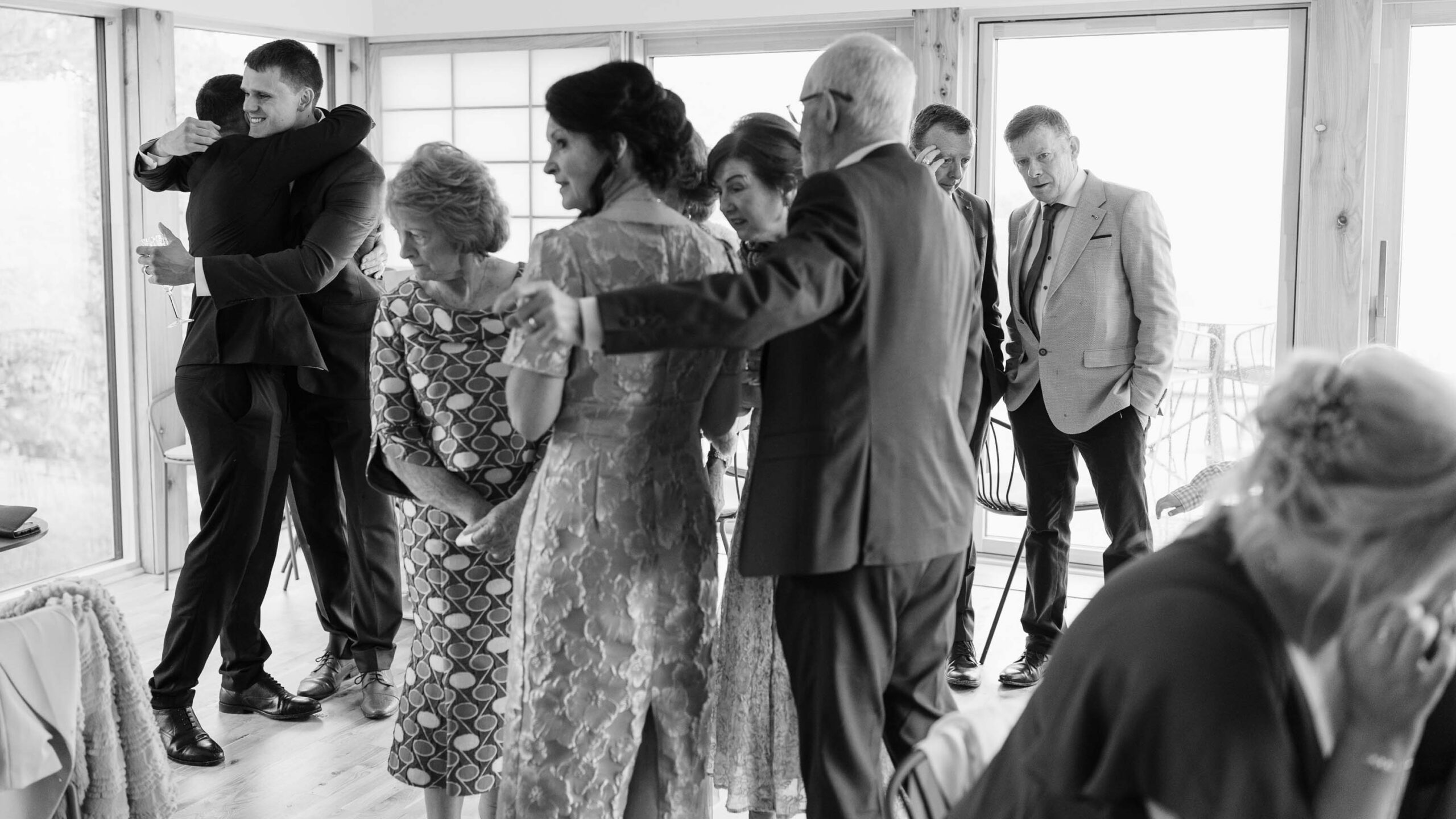 Groom watching bride walk to ceremony