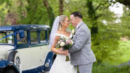 Bride and groom photographed naturally beside the river in Cork