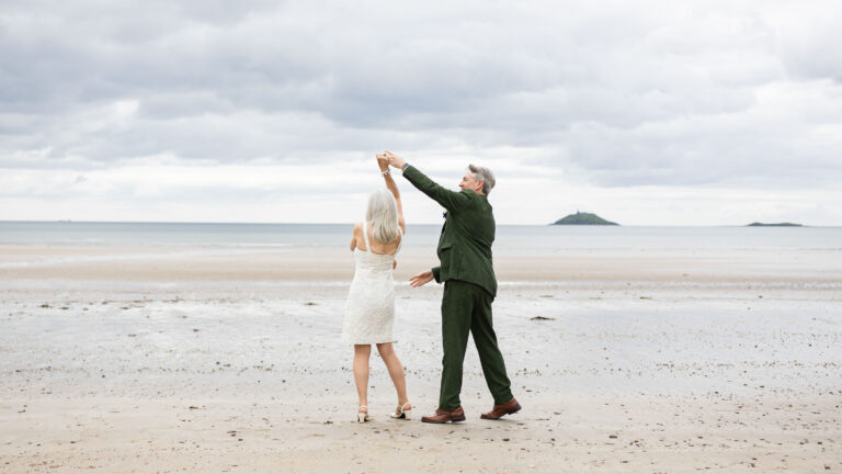 Couple dancing on Garryvoe beach after their vow renewal, East Cork