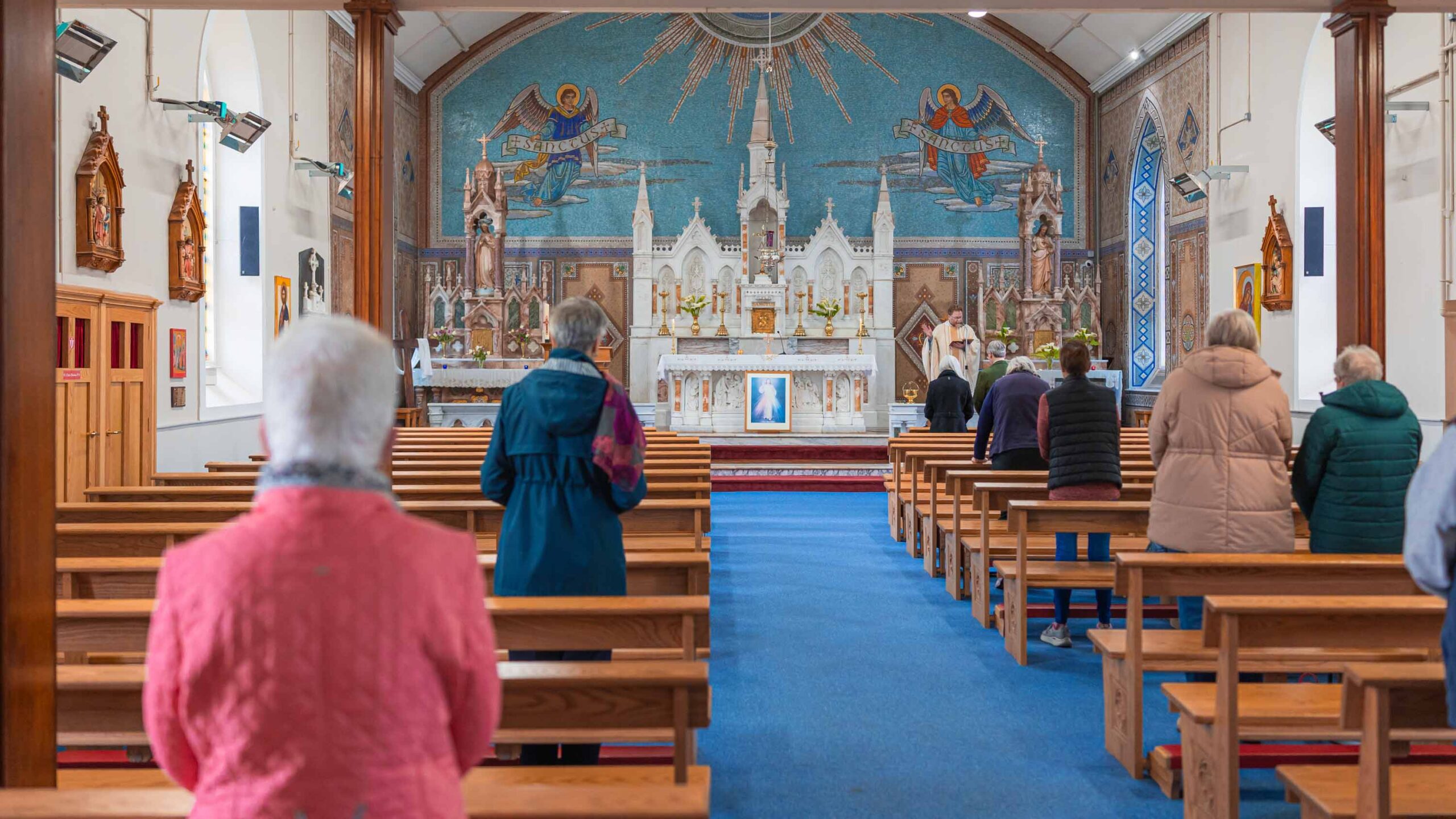 Priest blessing rings during renewal of vows in Ireland