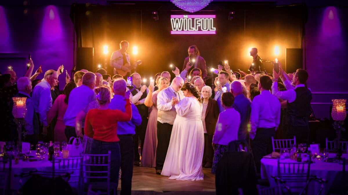 Bride and groom sharing their first dance surrounded by family and friends at an Irish wedding captured by JOD Photography