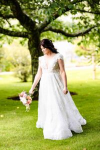 Bride walking through Vandeleur Walled Garden before ceremony