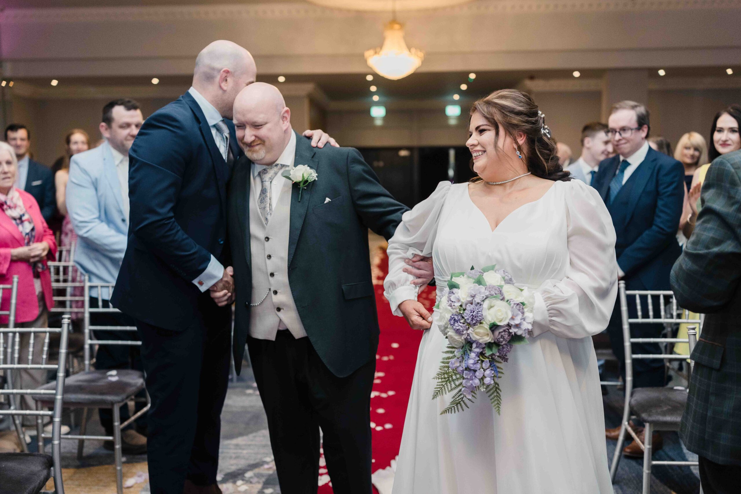 Chris meeting Elaine halfway down the aisle