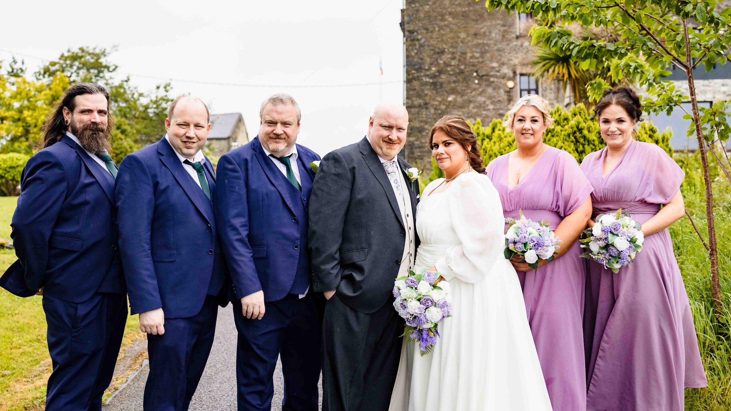 Bride and groom walking together at Ballea Castle