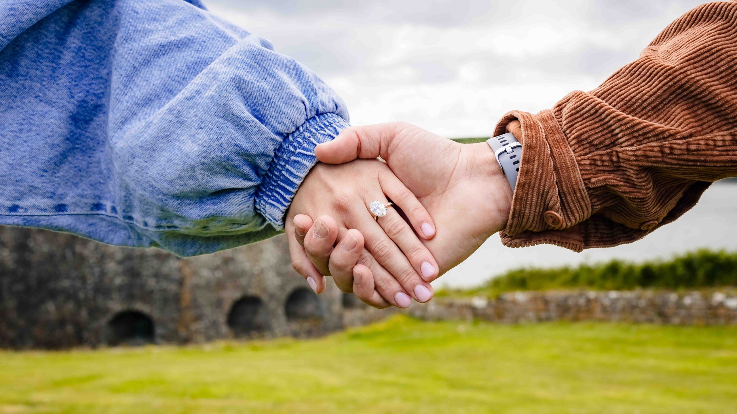 Couple embracing after surprise proposal in Kinsale