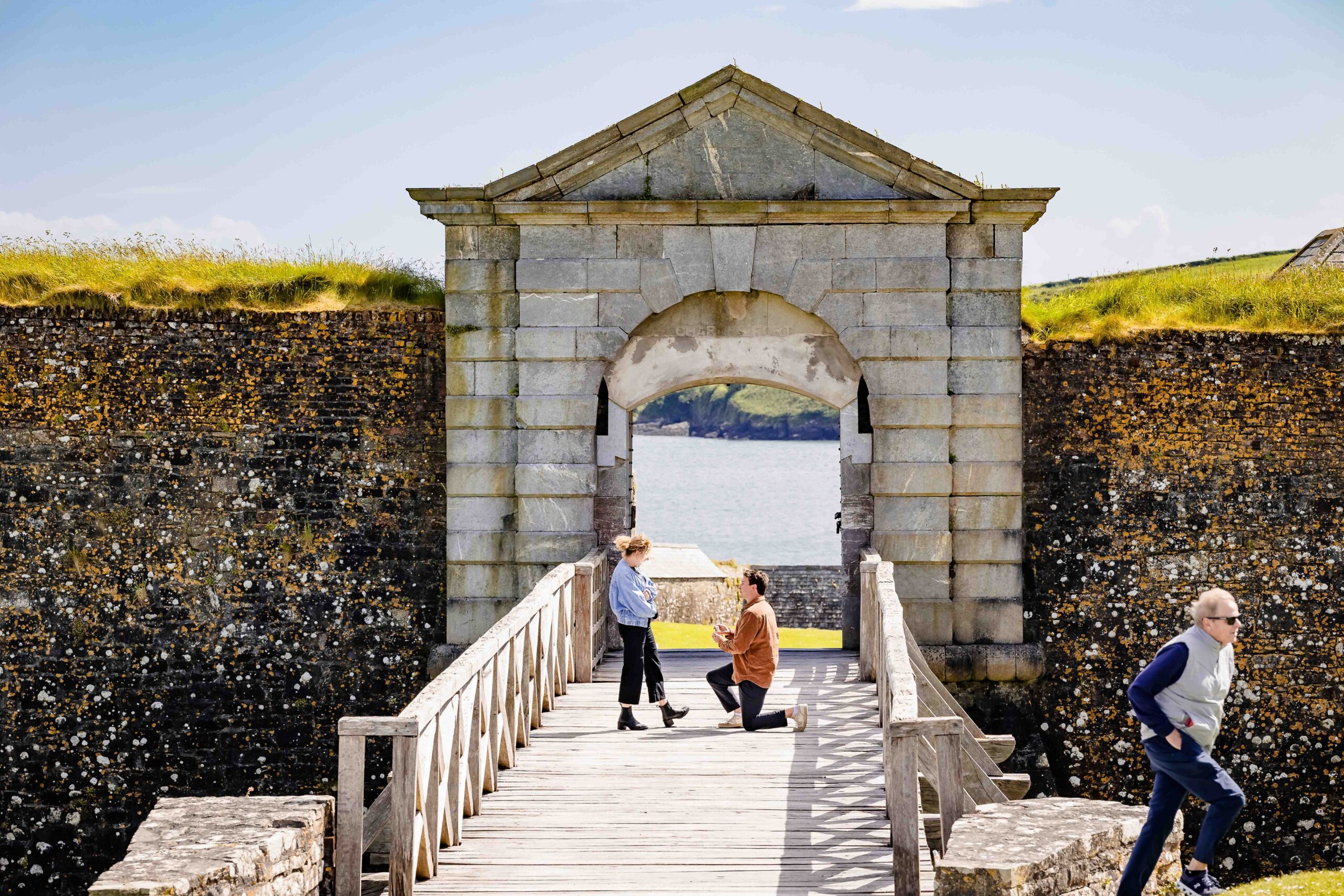 Clay proposing to Morgan on the bridge at Charles Fort Cork