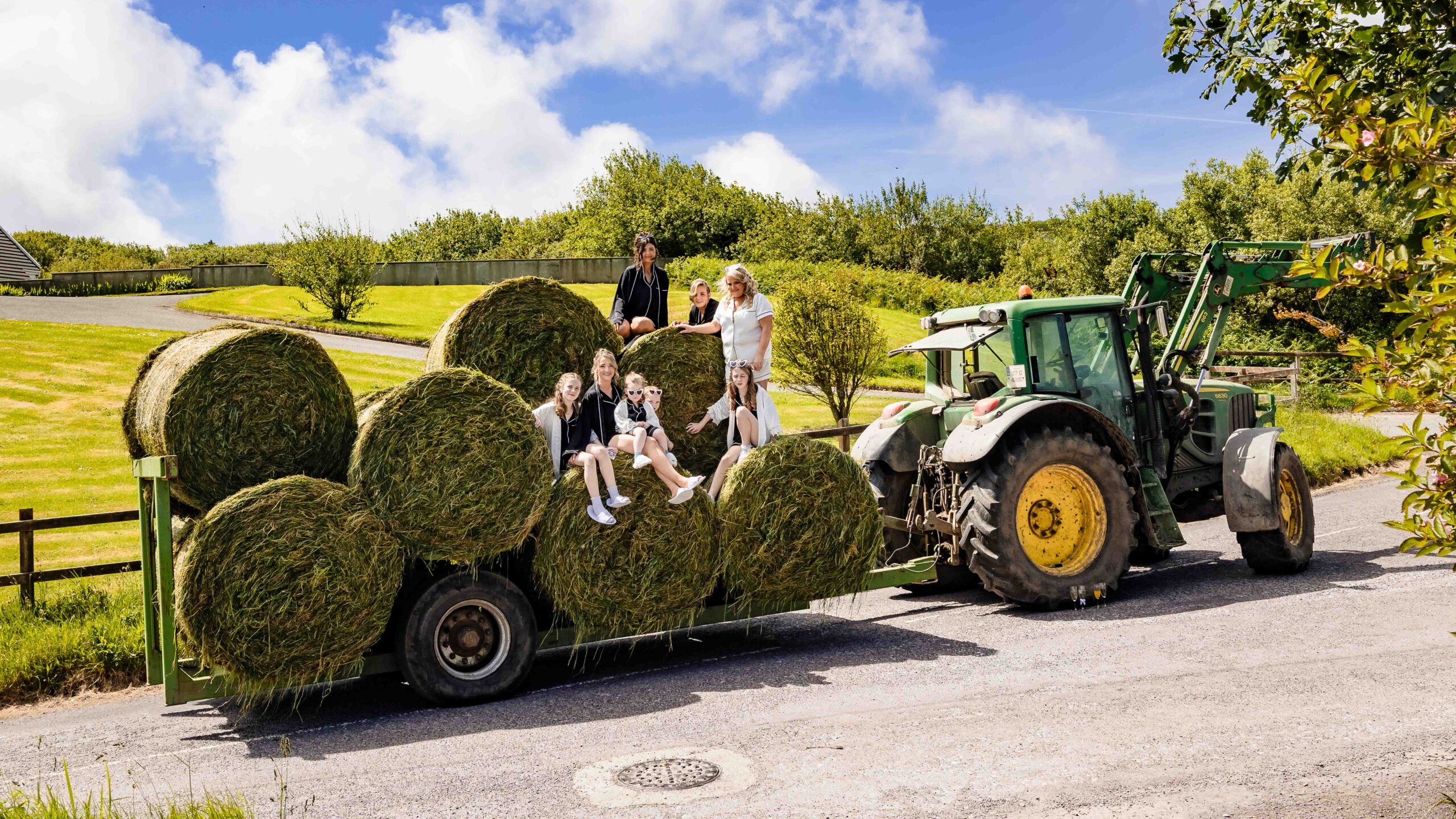 Kyra with her bridesmaids on a hay trailer in West Cork