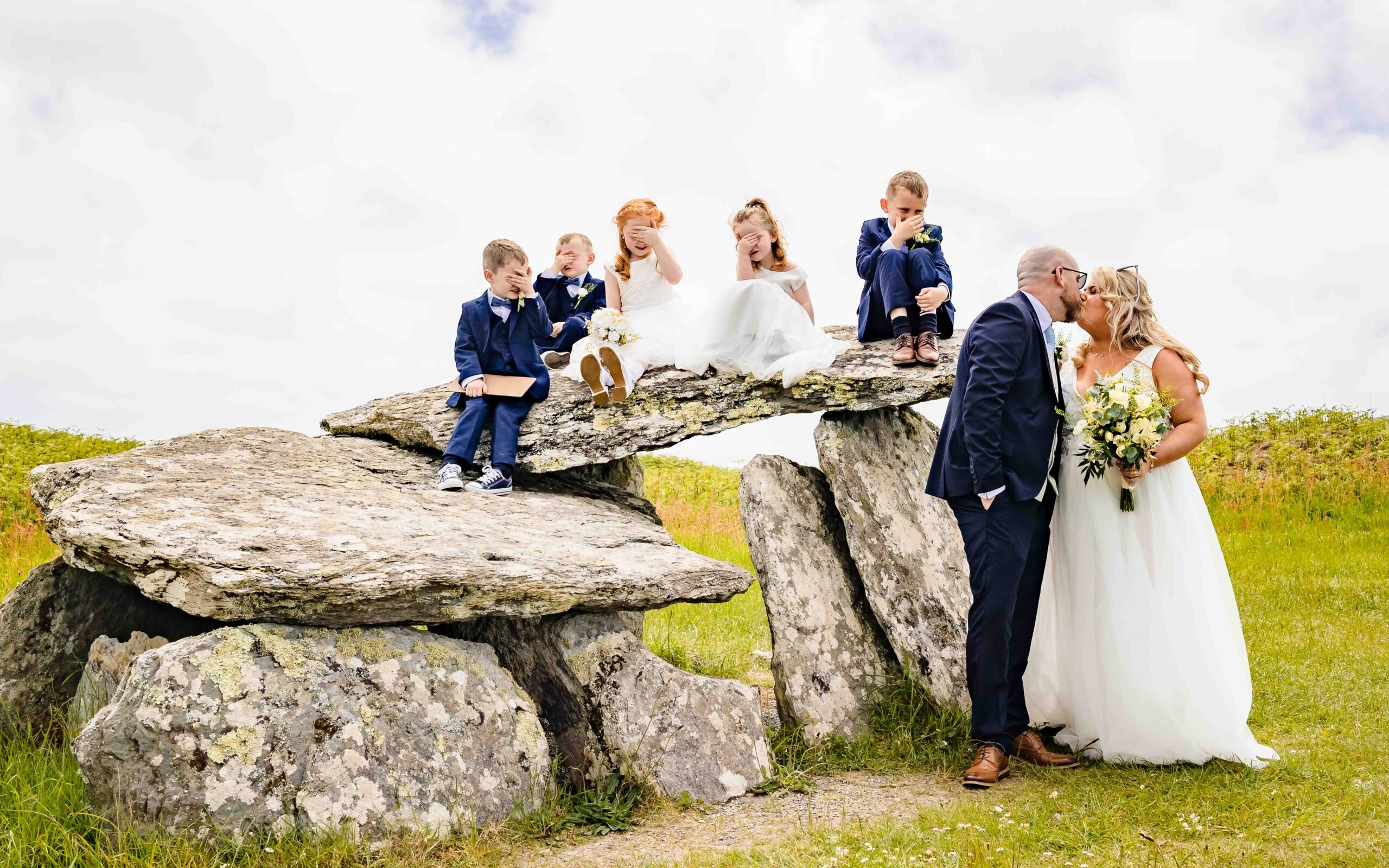 Children covering their eyes as their parents share a kiss in West Cork
