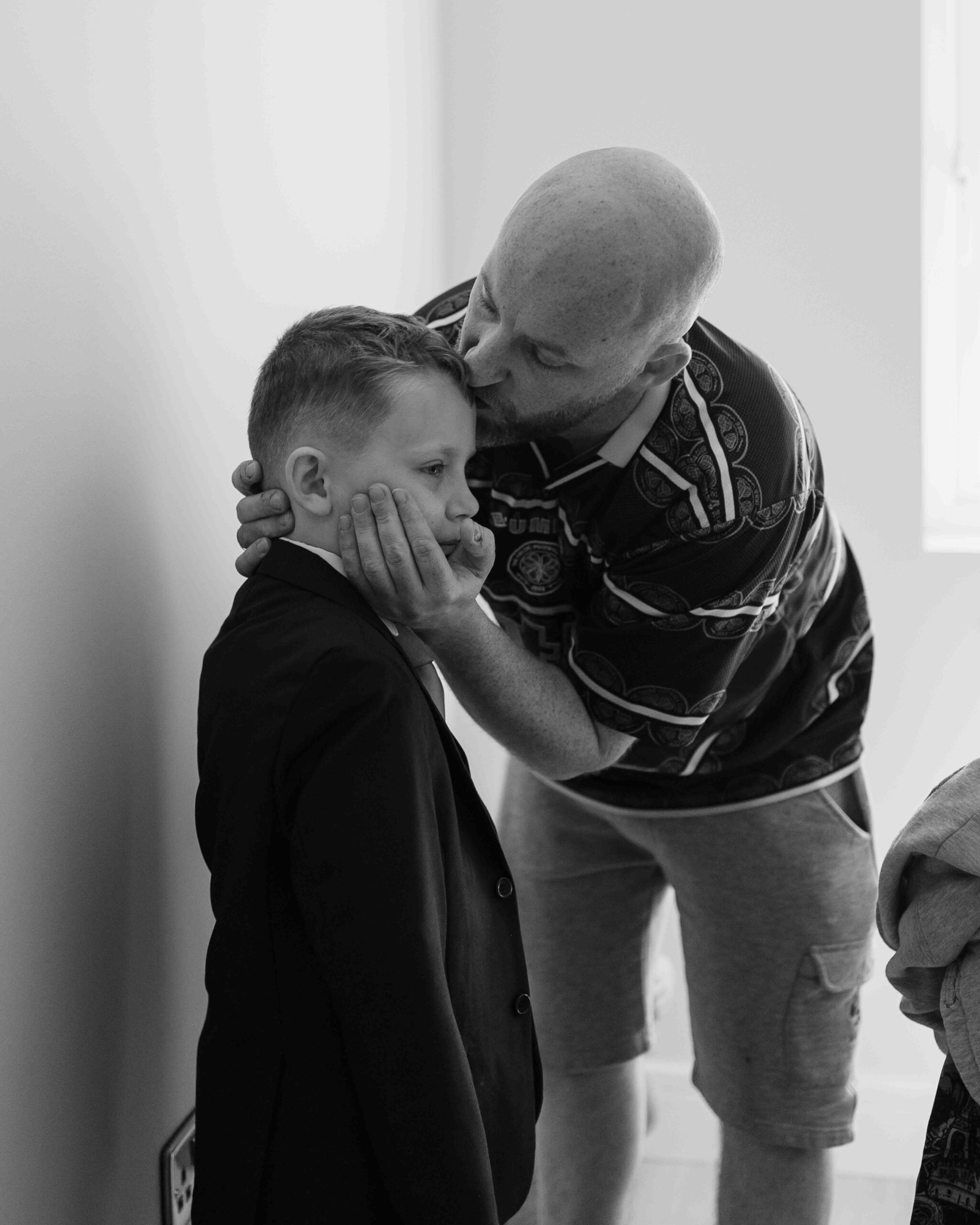 Groomsmen helping Chris with final wedding preparations