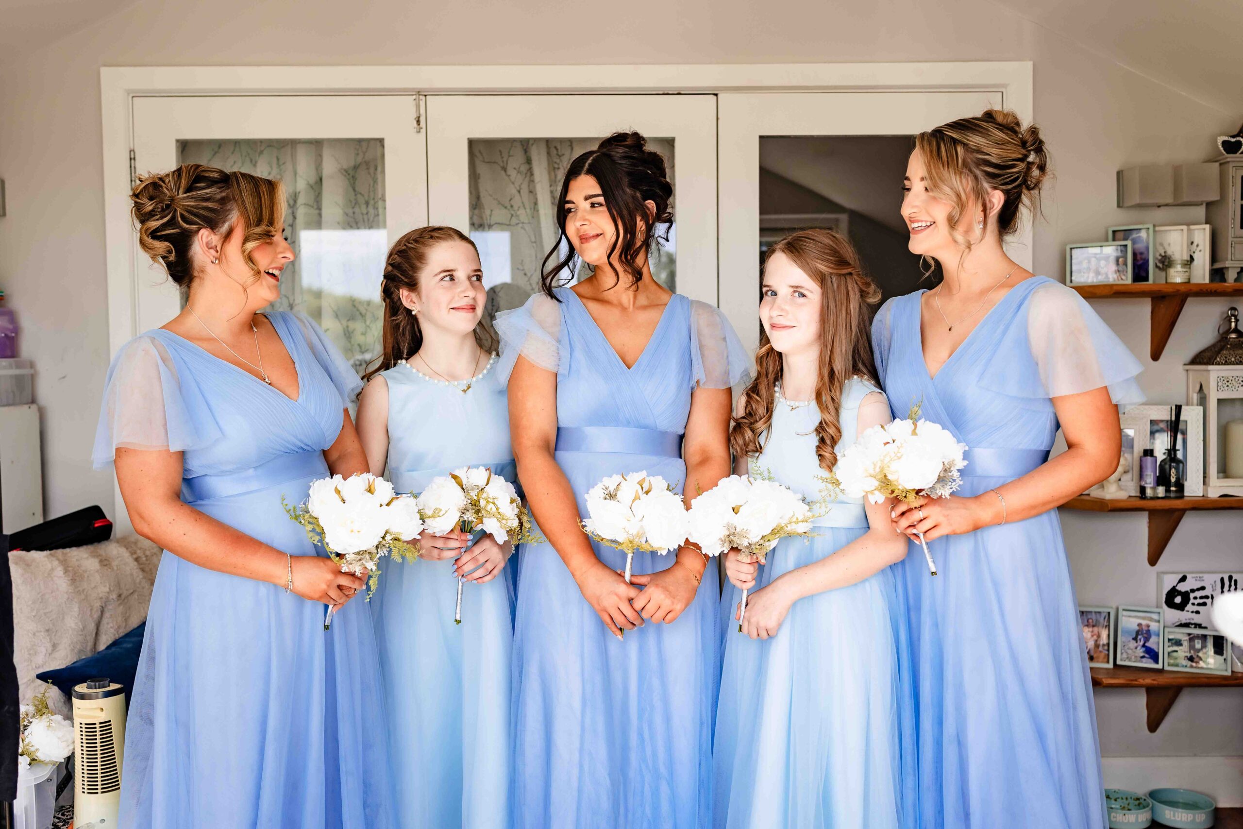 Bridesmaids sharing a fun candid moment before the ceremony