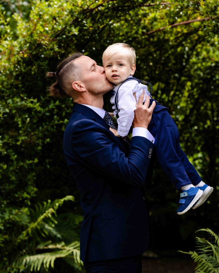 Groom playing with his son during the ceremony