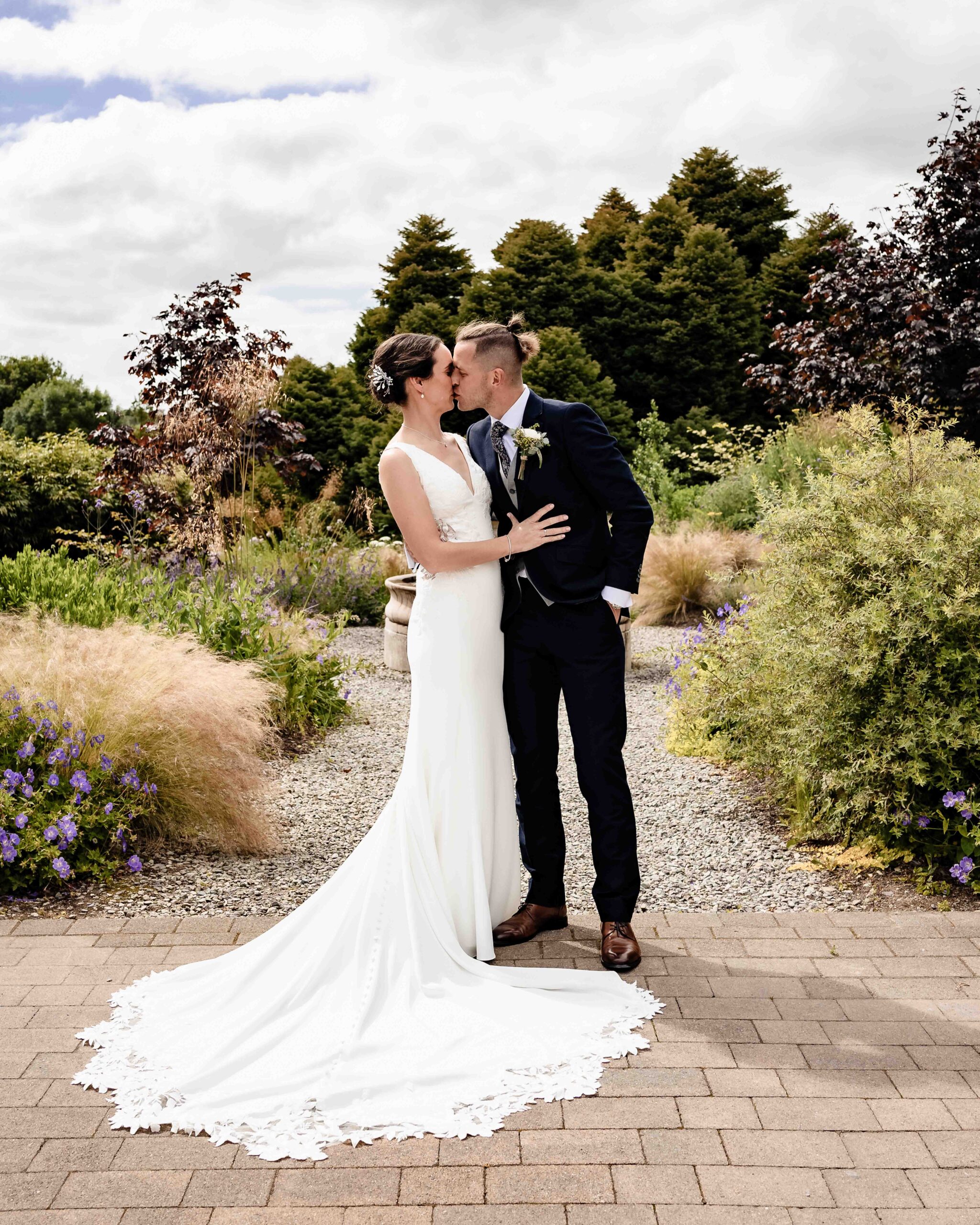 Natural wedding portraits surrounded by flowers at Fernhill House
