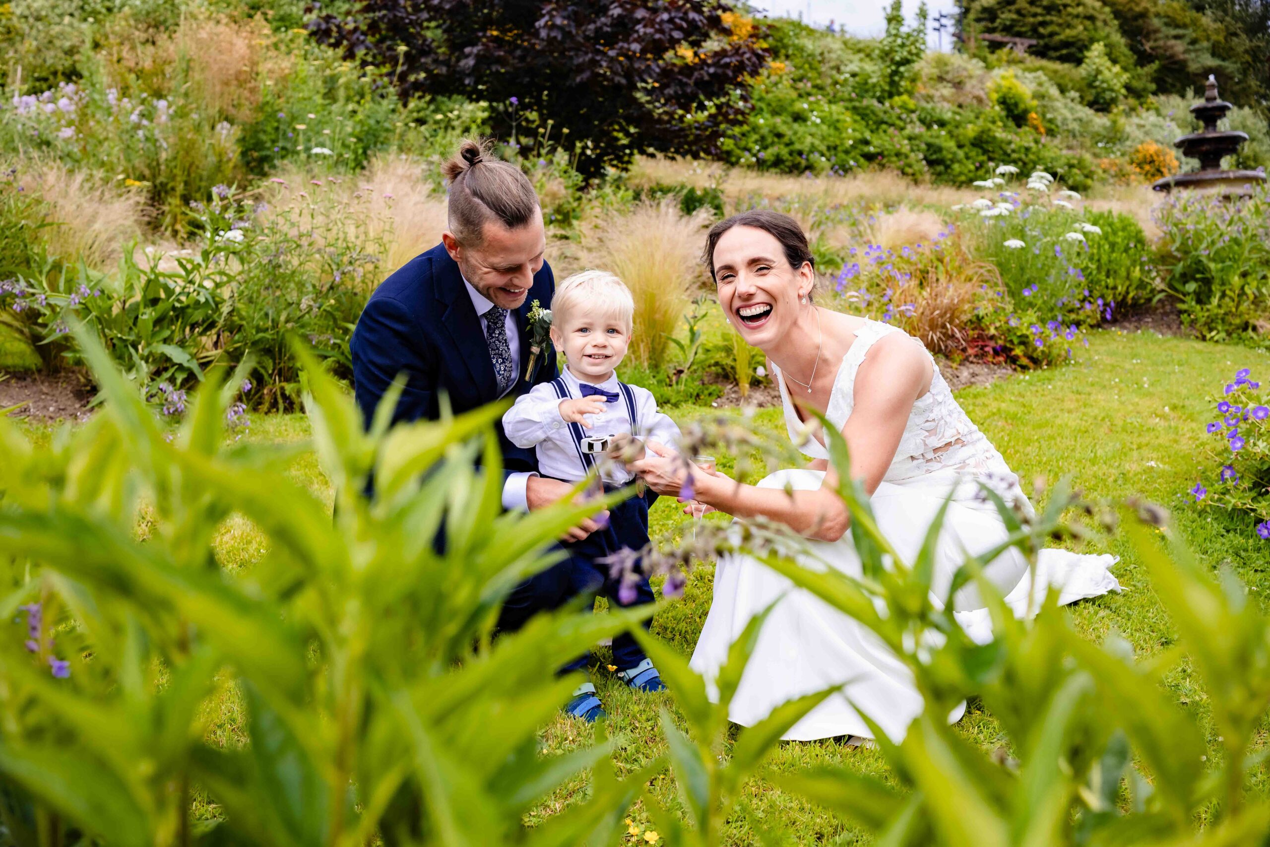 Julie and Lesley at an outdoor setting at Fernhill House, Clonakilty, Cork during their summer wedding, captured in natural light, documentary style - JOD Photography