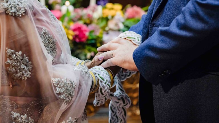 Close-up of the bride's hands decorated with traditional bridal bangles