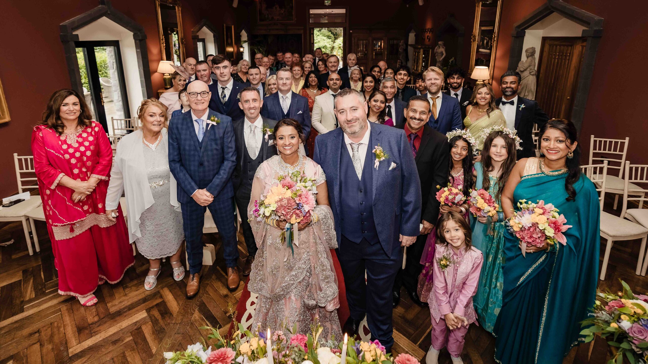 Monita and Damien outside the historic Ballyseede Castle in Tralee after their colourful Kerry wedding ceremony.