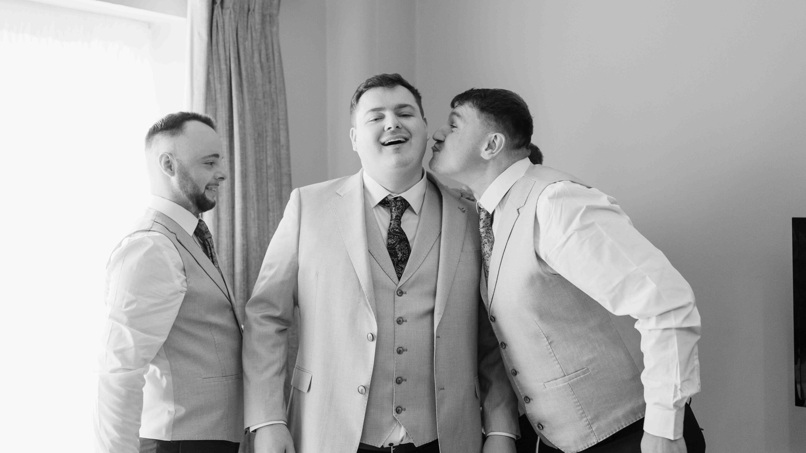 Bridesmaids and groomsmen celebrating with Caitlin and Jason