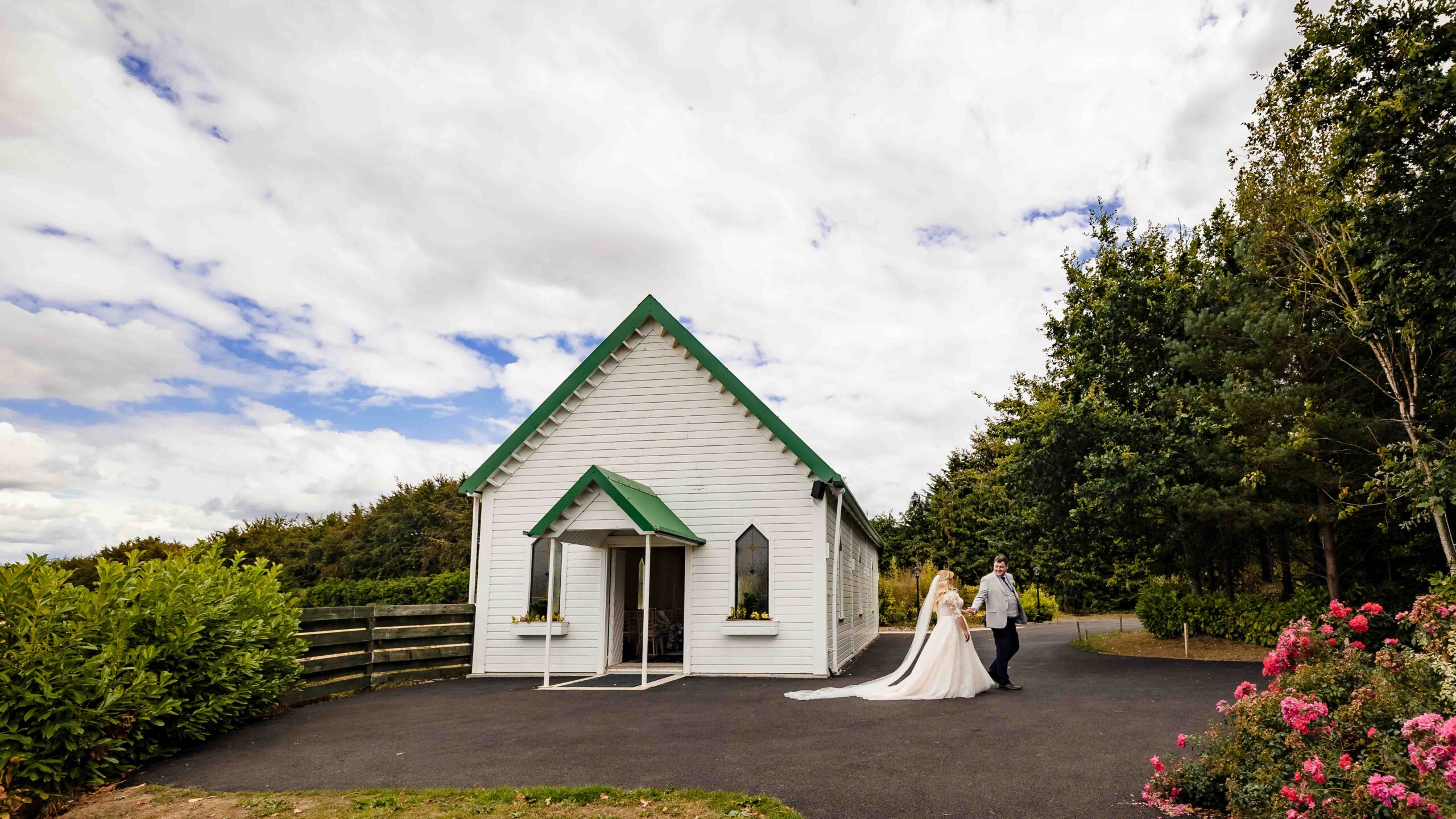 Newlyweds leaving the chapel at Clanard Court Hotel