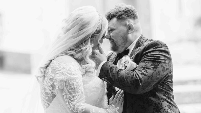 Black and white photo of the bride and groom nose to nose after their ceremony, Hotel Woodstock wedding, Co. Clare