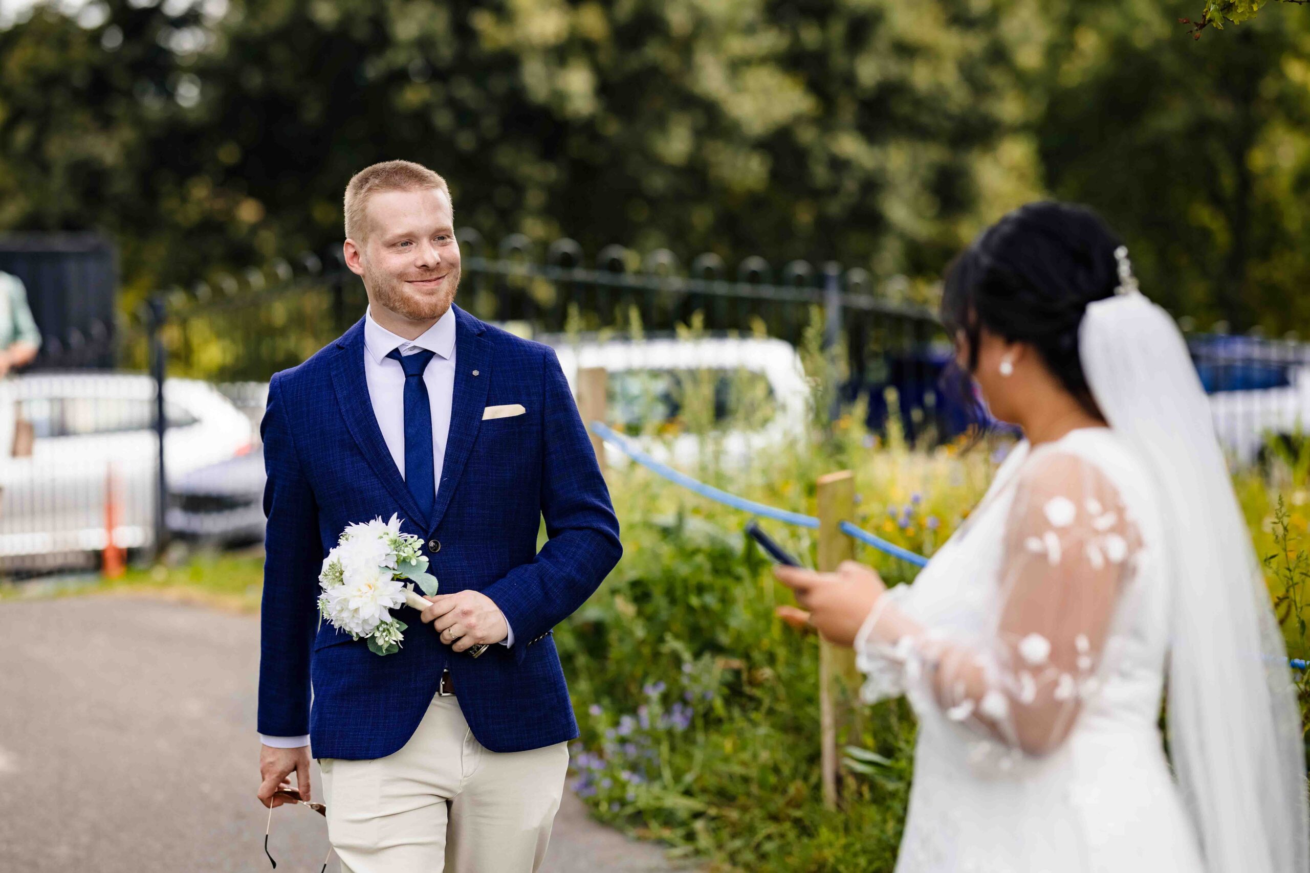Audrey smiling with her bouquet after her small wedding ceremony in Cork