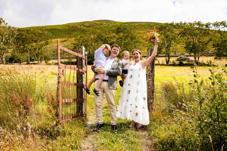 Aíne and Ciarán walking through the wild Irish countryside after their wedding