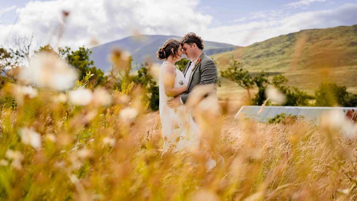 Aíne and Ciarán laughing together on their wedding day | JOD Photography