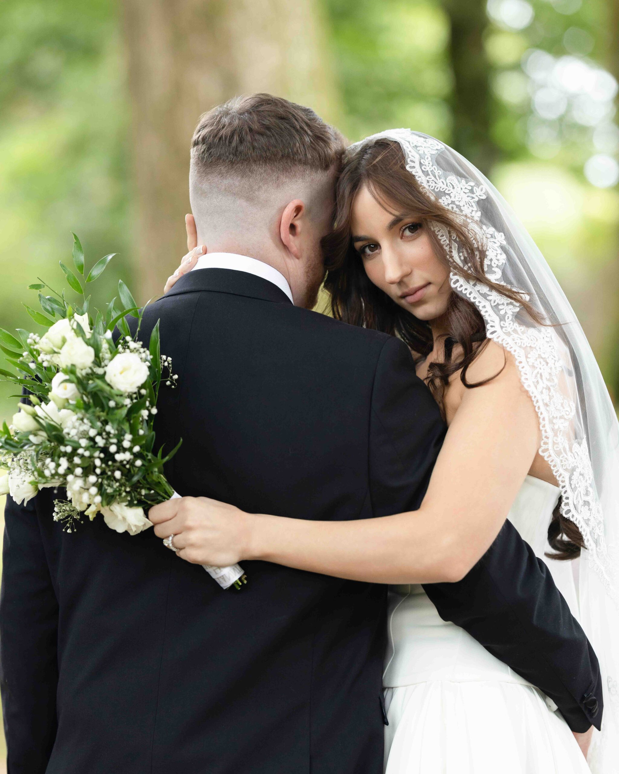 Andzelika listening to Evan's vows surrounded by woodland – JOD Photography