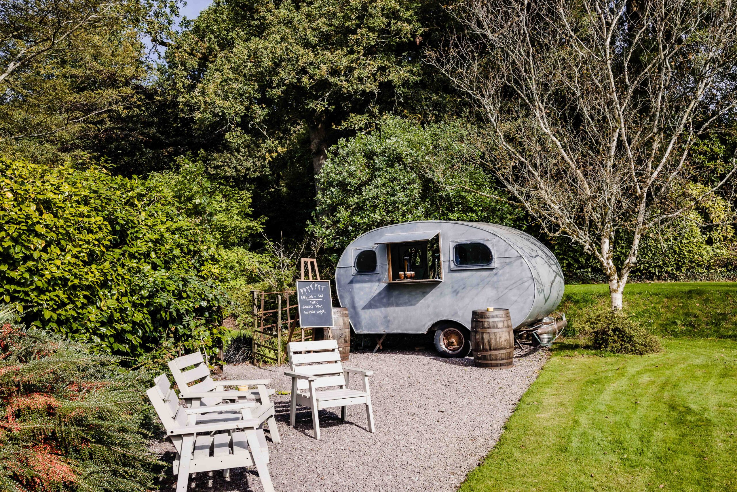 Bride making her way towards the woodland ceremony at Ballyvolane House – JOD Photography