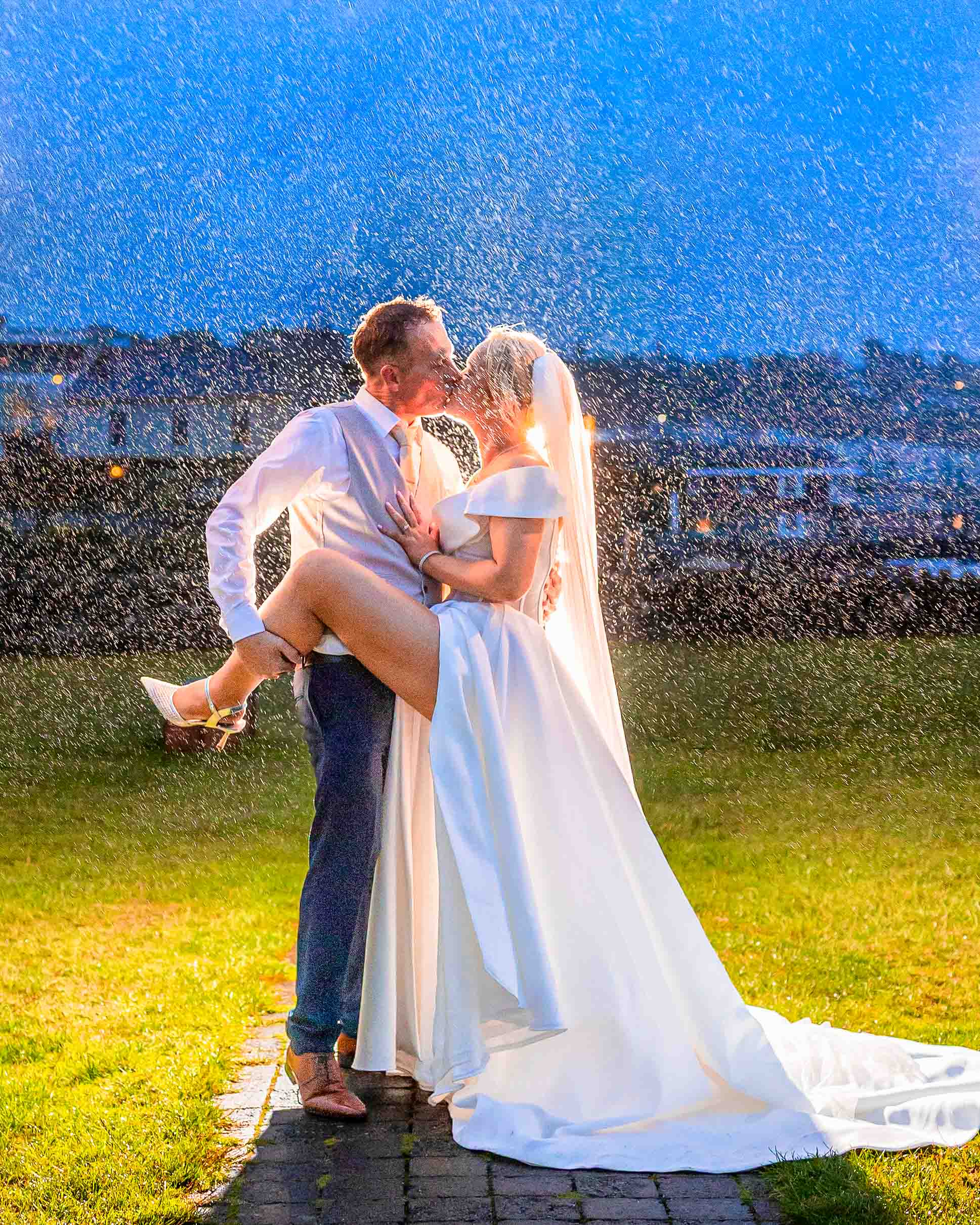 Dramatic rainy wedding portrait of Sinéad and Roly near Old Head Kinsale