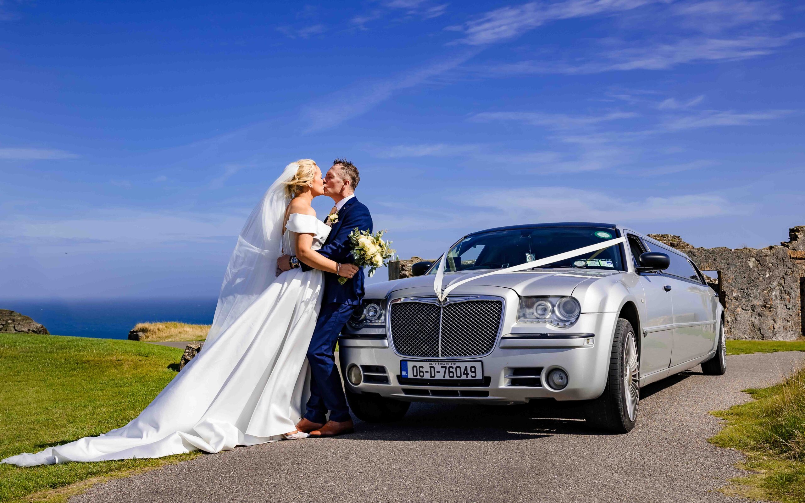 Newly married Sinéad and Roly leaving Holy Trinity Church surrounded by family and friends
