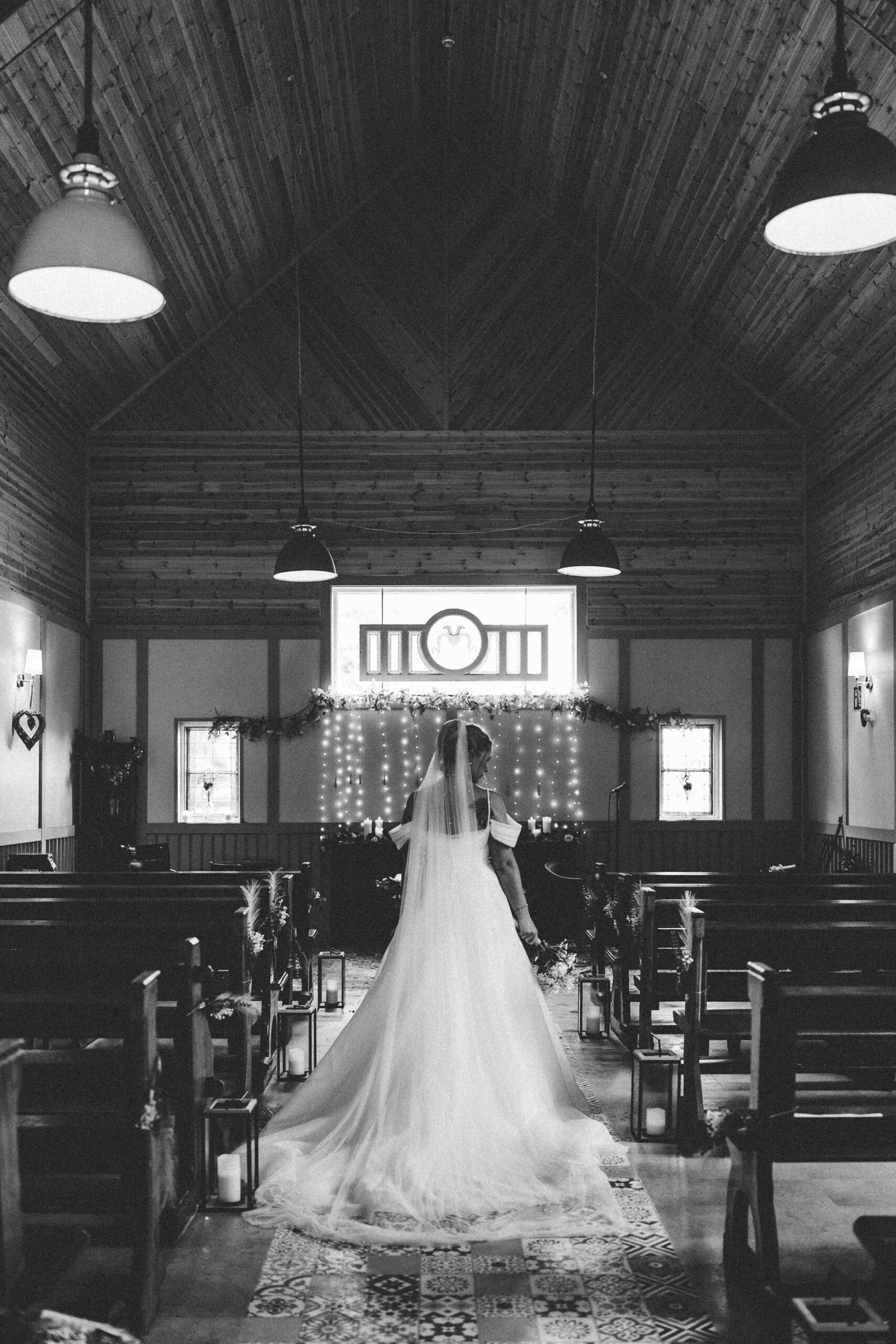Outdoor walkway leading towards The Village Barn wedding venue