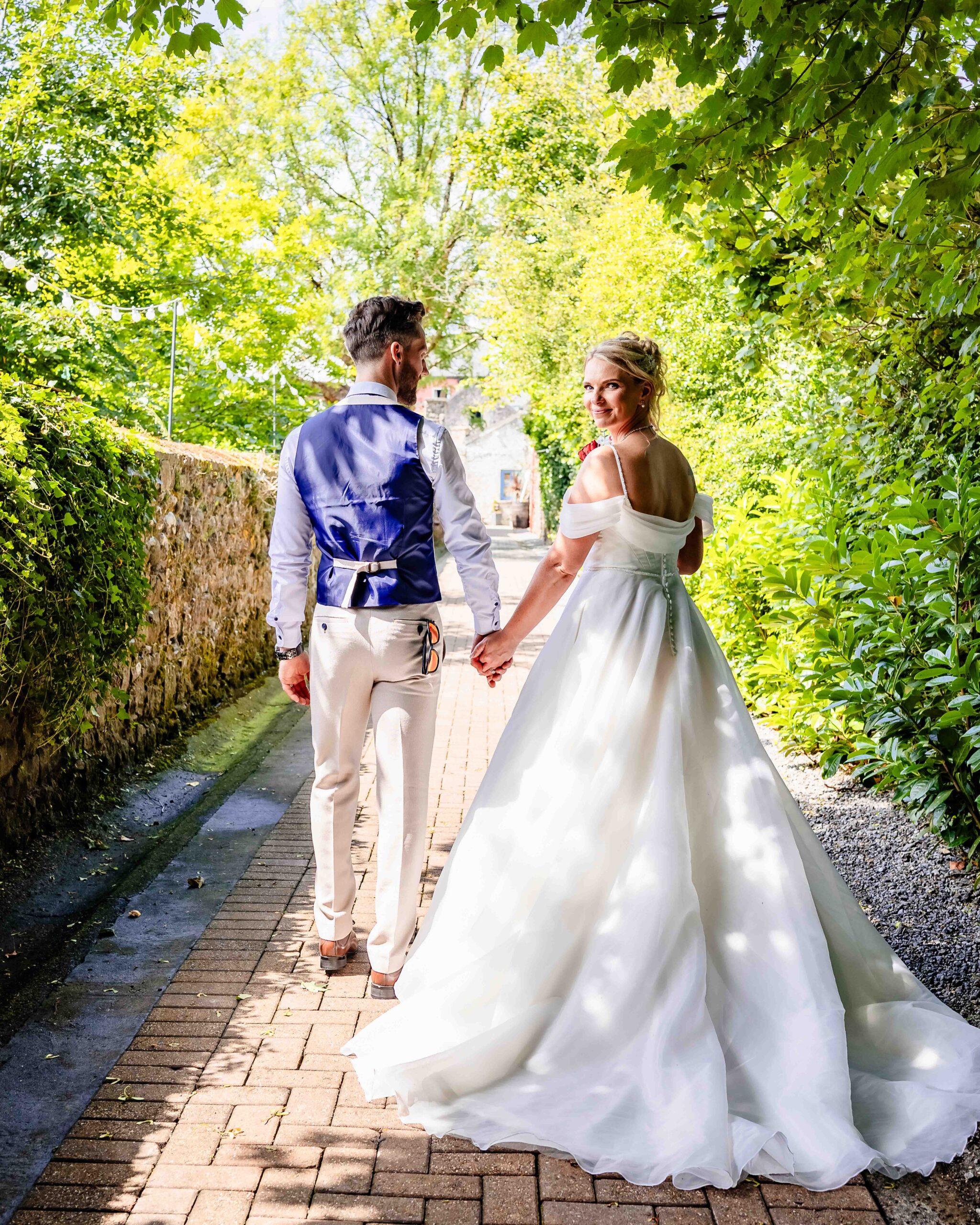 Shane and Suzy exchanging vows surrounded by family and friends