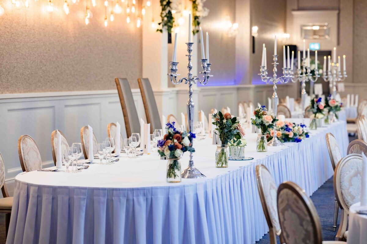 Wedding top table dressed with silver candelabras and autumn flowers at The Oaks Hotel in Killarney