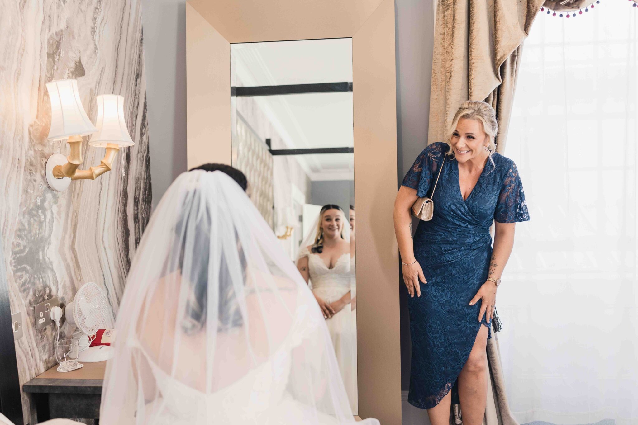 Shannon's mam Fiona smiles as she sees her daughter in her wedding dress at the Talbot Hotel Cork