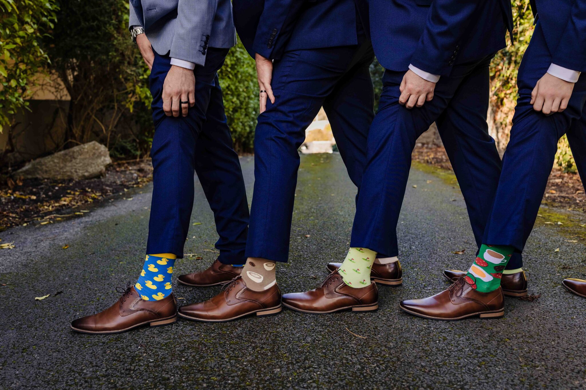 Brandon and his groomsmen show off their colourful socks and brown shoes at the Talbot Hotel Cork wedding
