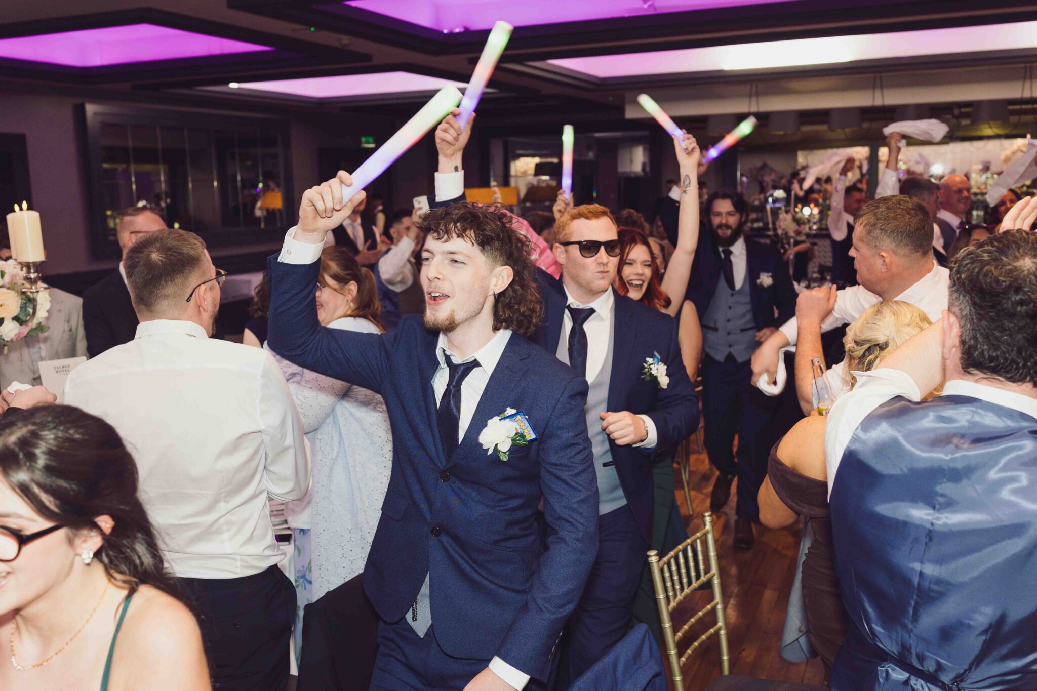 Brandon and the lads wave white napkins on the dance floor at the Talbot Hotel Cork wedding reception