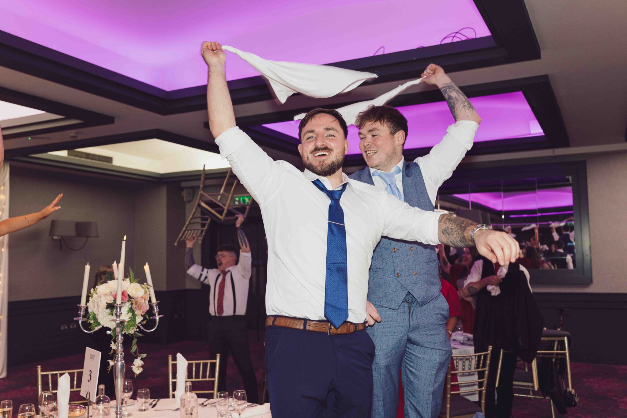 Guests swing white napkins above their heads during the Talbot Hotel Cork wedding reception party