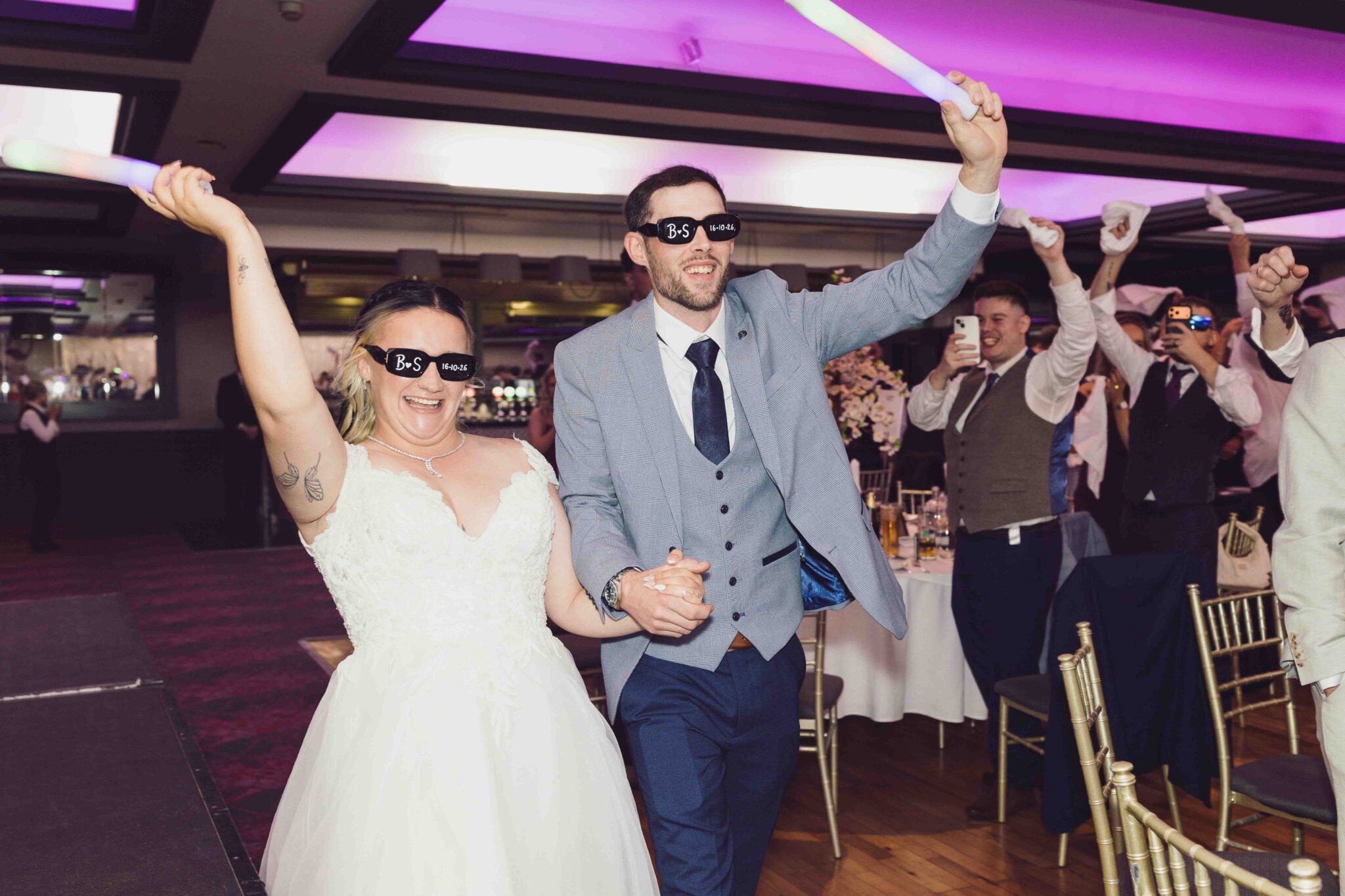 Shannon and Brandon dance with white napkins as guests cheer at the Talbot Hotel Cork wedding reception