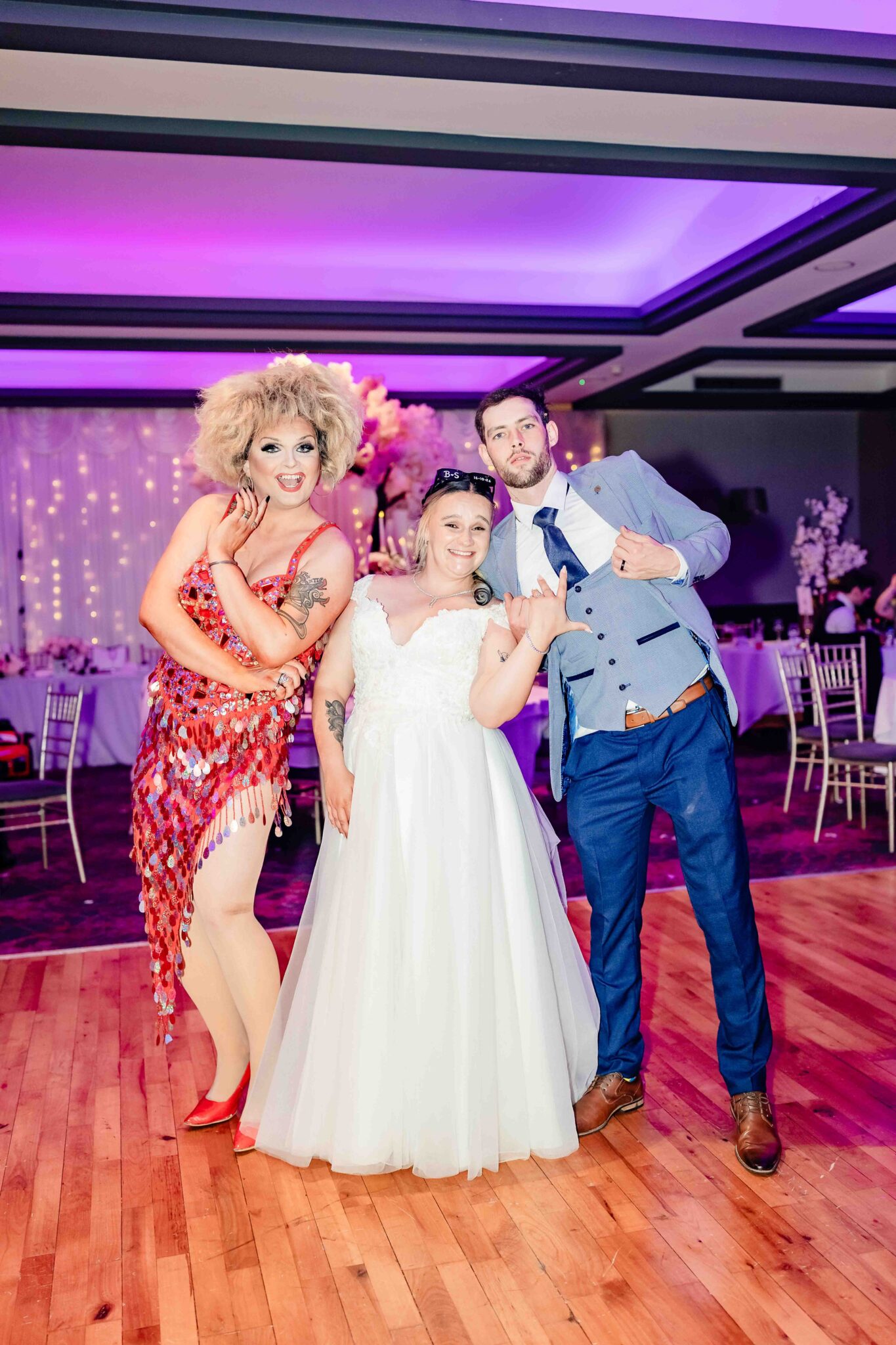 Shannon and Brandon pose with the singer in a red sequin dress on the dance floor at the Talbot Hotel Cork wedding