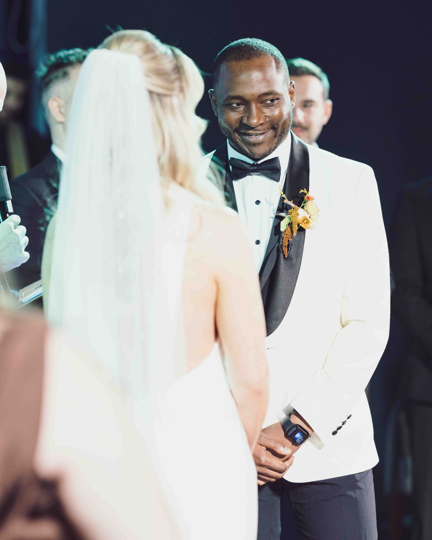 Groom Mahan smiles at Stacey in her veil during the wedding ceremony at Cork Church, Cork