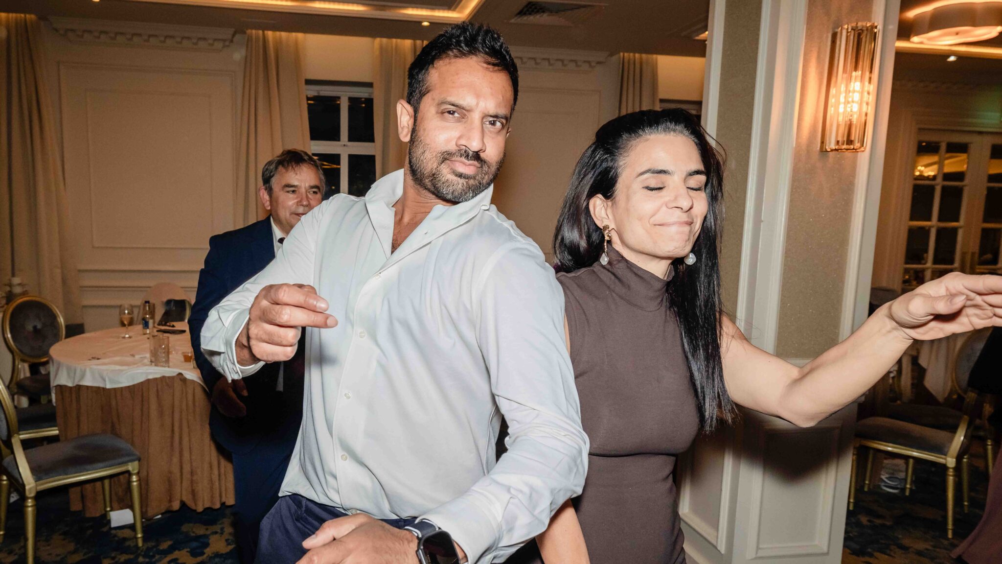 Wedding guests dance with big smiles at the Vienna Woods Hotel wedding reception, Cork